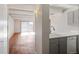Open concept kitchen and living room with hardwood floors at 1433 N Williams St # 801, Denver, CO 80218