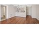 Living room with hardwood floors and kitchen view at 1433 N Williams St # 801, Denver, CO 80218