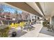 Outdoor patio area with tables, chairs, and grills at 1433 N Williams St # 801, Denver, CO 80218