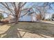 Image showcasing the side of a home with a fenced backyard and an attached garage at 4604 S Xavier St, Denver, CO 80236