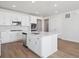 Modern kitchen with white cabinets, stainless steel appliances, and an island at 24510 E 36Th Ave, Aurora, CO 80019