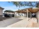 Large backyard features a carport, covered patio, a playground set, and a gazebo at 724 Ursula St, Aurora, CO 80011