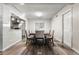 Well-lit dining room with hardwood floors and comfortable seating, showcasing an inviting space for Gathering meals at 724 Ursula St, Aurora, CO 80011