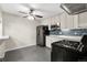 Contemporary kitchen featuring stainless steel appliances, modern cabinetry, and an efficient layout for cooking and entertaining at 724 Ursula St, Aurora, CO 80011