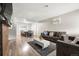 Cozy living room with hardwood floors, comfortable seating, and an adjacent dining area with ample natural light at 724 Ursula St, Aurora, CO 80011