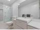 Bright bathroom features a shower and tub combo with updated vanity and ample lighting at 3970 S Syracuse Way, Denver, CO 80237