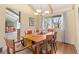 Well-lit dining room with stylish light fixture and backyard views at 3970 S Syracuse Way, Denver, CO 80237