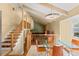 Bright dining room with vaulted ceilings, exposed beams, and modern chandelier lighting at 3970 S Syracuse Way, Denver, CO 80237