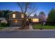 Charming home with well-manicured lawn, mature trees, and attached garage at 3970 S Syracuse Way, Denver, CO 80237