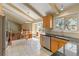 Bright kitchen with an open dining area and tile flooring at 3970 S Syracuse Way, Denver, CO 80237