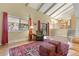Open living area features bright windows, hardwood floors, and easy access to dining area at 3970 S Syracuse Way, Denver, CO 80237