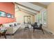Cozy living room featuring a white couch, display case, and large window at 3970 S Syracuse Way, Denver, CO 80237