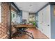 Finished basement office area with wood-look floors and exposed brick walls at 2874 Se Grapevine Rd, Idledale, CO 80453