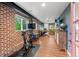 Finished basement featuring exposed brick, home gym and office space and wood-look floors at 2874 Se Grapevine Rd, Idledale, CO 80453