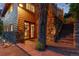 Charming log home featuring stone accents, a cozy entryway, and warm lighting at 2874 Se Grapevine Rd, Idledale, CO 80453