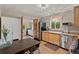 Bright kitchen with stainless steel appliances and a dining area at 2874 Se Grapevine Rd, Idledale, CO 80453