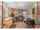 Cozy kitchen with wooden cabinets, stainless steel appliances, and tile flooring at 2874 Se Grapevine Rd, Idledale, CO 80453