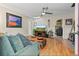 Inviting living room with hardwood floors, ceiling fan, and stylish decor at 2874 Se Grapevine Rd, Idledale, CO 80453