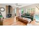 Comfortable living room featuring a stone fireplace and hardwood flooring at 2874 Se Grapevine Rd, Idledale, CO 80453