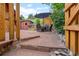 Outdoor patio featuring stone steps, a dining area with an umbrella, and a shed at 2874 Se Grapevine Rd, Idledale, CO 80453
