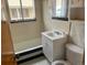 Full bathroom with white vanity and tiled walls and shower at 3531 Forest St, Denver, CO 80207
