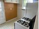 Practical kitchen space with white appliances and retro flooring at 3531 Forest St, Denver, CO 80207