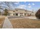 Charming townhome with beautiful landscaping, stone front, and classic architectural details at 4641 W Ponds Cir, Littleton, CO 80123