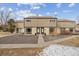 Inviting townhome with a well-kept exterior, stone landscaping, and attractive design at 4641 W Ponds Cir, Littleton, CO 80123