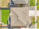 An overhead shot captures a home's roof, backyard, and surrounding landscape in a residential setting at 4644 Hatcher Dr, Brighton, CO 80601