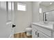 Bathroom with laminate floors, quartz countertop, and modern fixtures at 4644 Hatcher Dr, Brighton, CO 80601