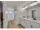 Contemporary bathroom featuring double sinks and a glass shower at 4644 Hatcher Dr, Brighton, CO 80601