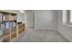 View of bedroom with a full bookshelf, large closet, and grey carpet at 4644 Hatcher Dr, Brighton, CO 80601