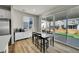 Eat-in kitchen area leads to backyard via sliding doors and patio view at 4644 Hatcher Dr, Brighton, CO 80601