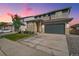 Two-story home featuring stone accents, neutral siding, and a two car garage at 4644 Hatcher Dr, Brighton, CO 80601