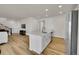 Bright kitchen boasts an island with sink, stainless steel appliances, and ample cabinet space at 4644 Hatcher Dr, Brighton, CO 80601