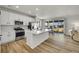 Modern kitchen featuring stainless steel appliances, a kitchen island, and sliding glass doors at 4644 Hatcher Dr, Brighton, CO 80601