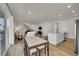 Open-concept living area features stairs, dining area, and kitchen at 4644 Hatcher Dr, Brighton, CO 80601