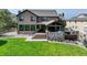 The perfect backyard with a private deck and outdoor kitchen space is an entertainer's dream at 6078 Bridle Path Ln, Parker, CO 80134