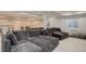 Finished basement with a large sectional couch, recessed lighting and an open floor plan at 6078 Bridle Path Ln, Parker, CO 80134