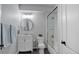 Updated bathroom featuring new fixtures, a glass shower, vanity and slate gray tile flooring at 6078 Bridle Path Ln, Parker, CO 80134