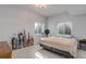 Neutral bedroom with a beige bedspread, trophies, soft carpet and natural light at 6078 Bridle Path Ln, Parker, CO 80134