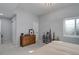 Light-filled bedroom with wood dresser, wall decor, plush carpet and natural light at 6078 Bridle Path Ln, Parker, CO 80134