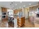 Gourmet kitchen featuring a large island, stainless steel appliances, and custom cabinetry at 6078 Bridle Path Ln, Parker, CO 80134