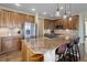 Spacious kitchen features stainless steel appliances, granite countertops, and a large center island with seating at 6078 Bridle Path Ln, Parker, CO 80134