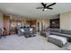 Open-concept living area with kitchen, dining, and living spaces seamlessly connected at 6078 Bridle Path Ln, Parker, CO 80134