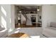 Open-concept living room with a view of the staircase, and ample seating at 6078 Bridle Path Ln, Parker, CO 80134