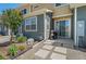 Cozy patio area with a grill, set in a well-maintained backyard with stepping stones and garden features at 9719 Albion Ln, Thornton, CO 80229