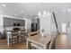 Bright and airy kitchen with gray cabinetry, stainless steel appliances, and a dining area with stylish seating at 9719 Albion Ln, Thornton, CO 80229