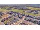 Scenic aerial view of a suburban neighborhood with lush green spaces and well-maintained streets at 8728 Hotchkiss St, Littleton, CO 80125