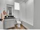 Clean bathroom featuring a shower-tub combo, vanity sink, and modern fixtures at 8728 Hotchkiss St, Littleton, CO 80125